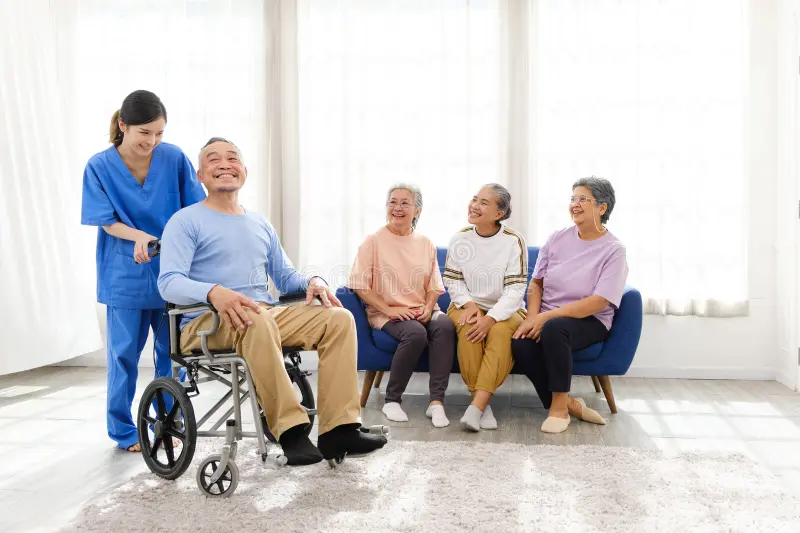 caregiver-therapist-stands-asian-senior-sitting-wheelchair-group-women-sofa-background-nursing-home-299023669